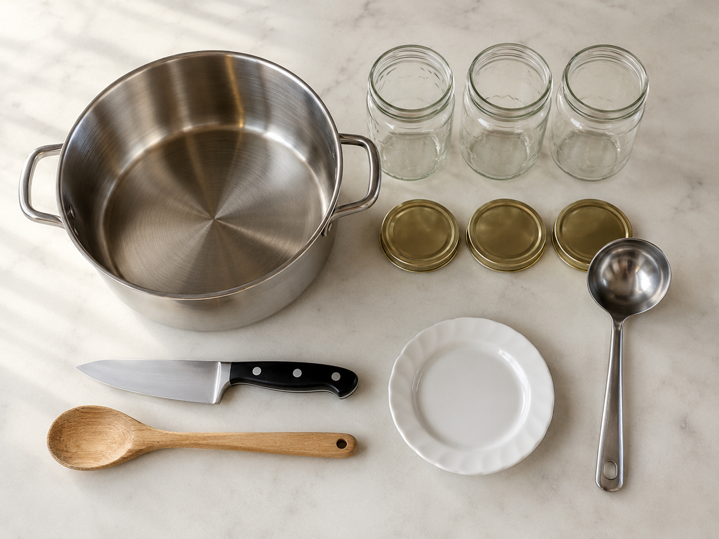 Essential jam making equipment including wide pot, jars, and ladle